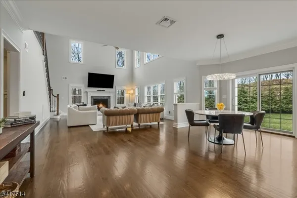 a living room with furniture fireplace and a flat screen tv