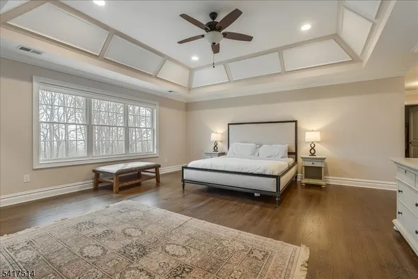 a spacious bedroom with a bed and a fireplace