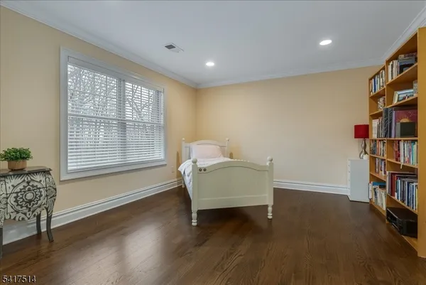 a living room with furniture a table and a potted plant
