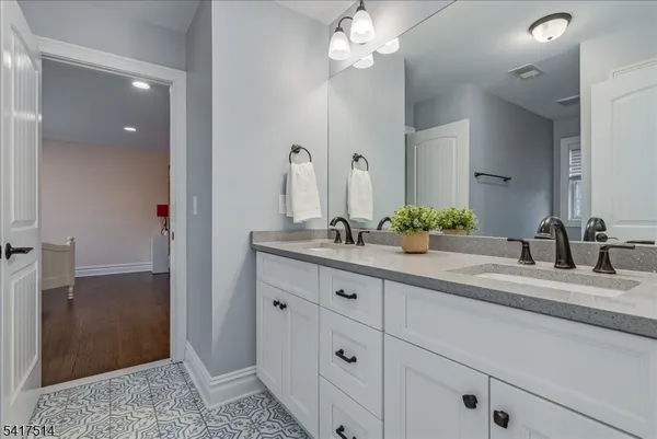 a room with gym equipment and a flat screen tv