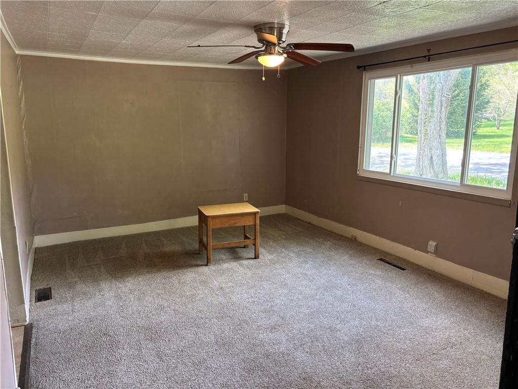 44 Bedford Road West Middlesex, PA 16159 - Photo 5 of 12 an empty room with windows and fan