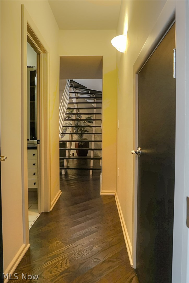 3740 Granger Road Akron, OH 44333 - Photo 29 of 33 Hallway from LL office going towards stairs, LL family room is to left of stairs.