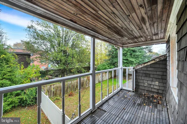 a view of balcony with wooden floor