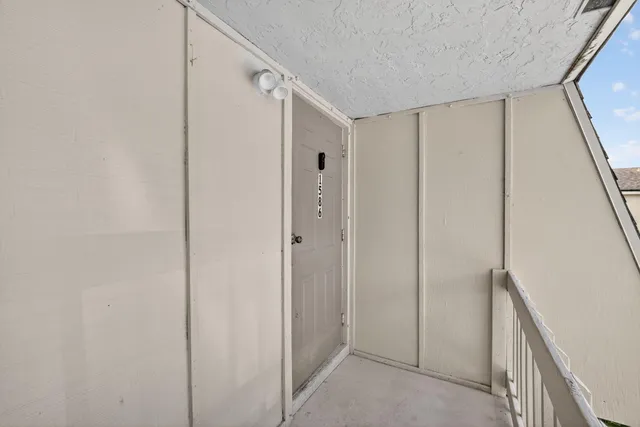 a view of a hallway with closet area