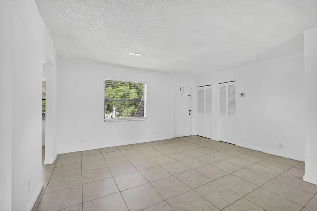 a view of an empty room and window