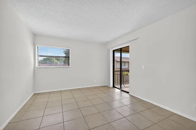 a view of an empty room with windows