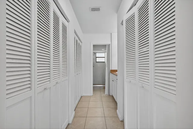a view of a hallway with a white door