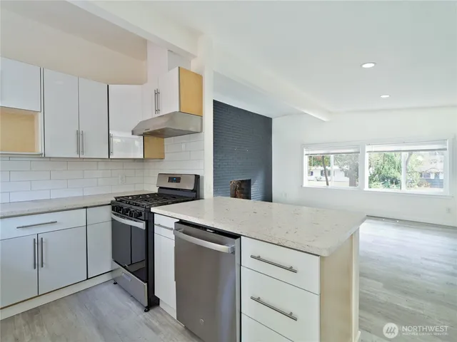 a kitchen with a stove and a sink
