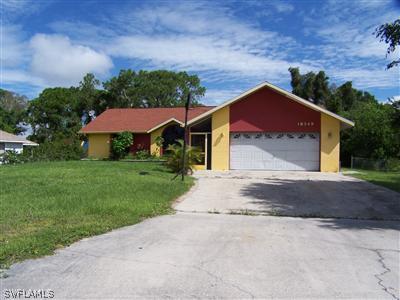 18349 Matanzas Road Fort Myers, FL 33967 - Photo 1 of 10 a front view of a house with a yard