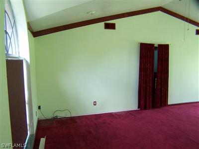 18349 Matanzas Road Fort Myers, FL 33967 - Photo 3 of 10 a view of a big room with wooden floor and windows