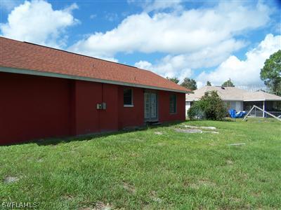 18349 Matanzas Road Fort Myers, FL 33967 - Photo 10 of 10 a backyard of a house with lots of green space