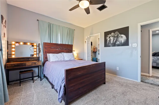 a view of a hallway with wooden shelves