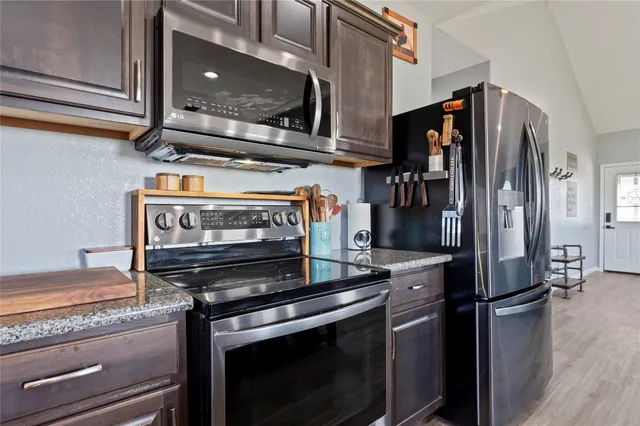 a work room with furniture and a chandelier
