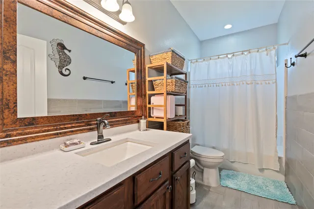 a living room with furniture and white walls