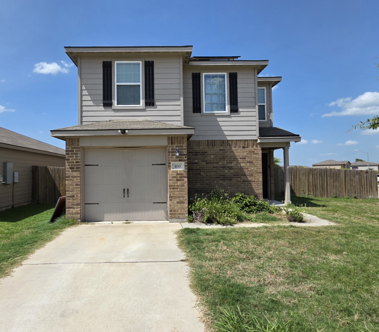 A welcoming facade with a garage and inviting landscaping, perfect for everyday living.