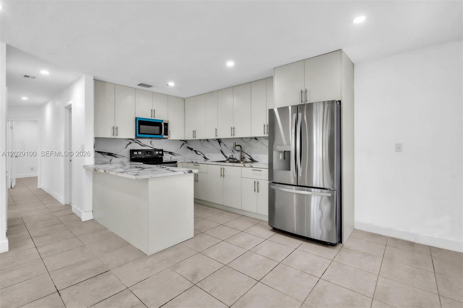 11790 Southwest 34th Street Miami, FL 33175 - Photo 16 of 56 a kitchen with cabinets and stainless steel appliances