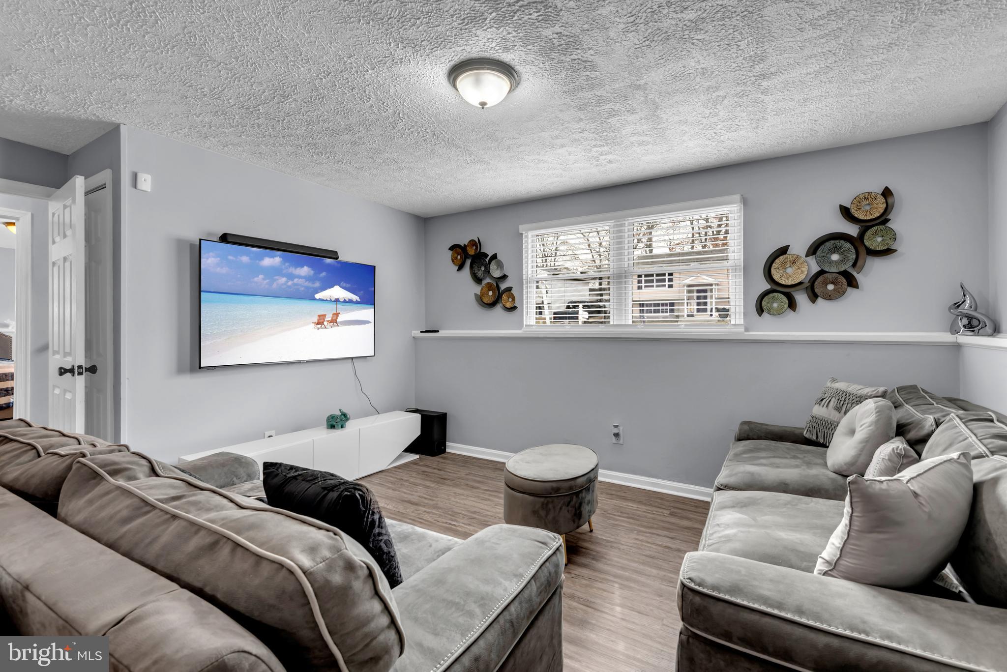 617 Fuselage Avenue Baltimore, MD 21221 - Photo 19 of 37 TV & Game Room View 1