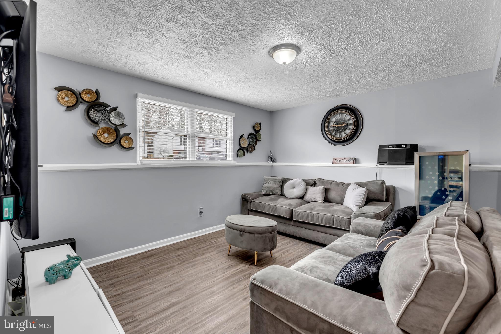 617 Fuselage Avenue Baltimore, MD 21221 - Photo 20 of 37 TV & Game Room View 2