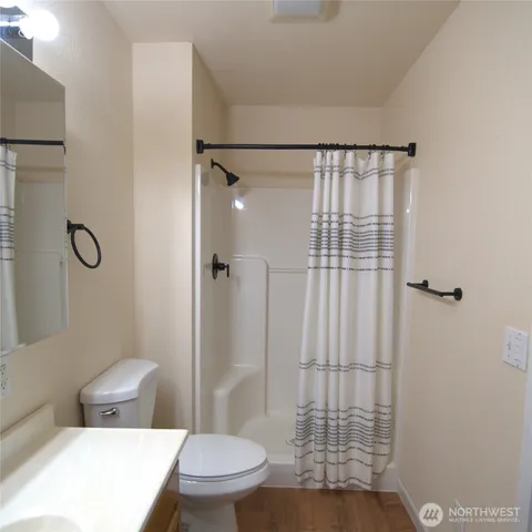 a white toilet sitting next to a bathroom sink