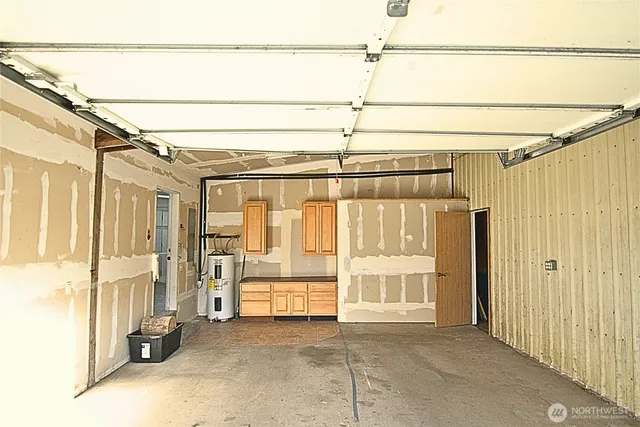 a view of a room with wooden walls