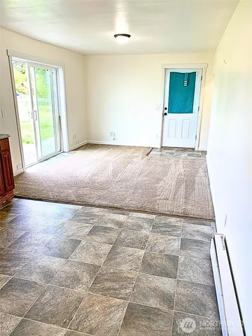 a bathroom with a shower and a sink