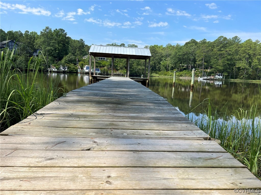 1065 Griffin's Landing Road Lancaster, VA 22503 - Photo 13 of 18 a view of a lake with a house in the background