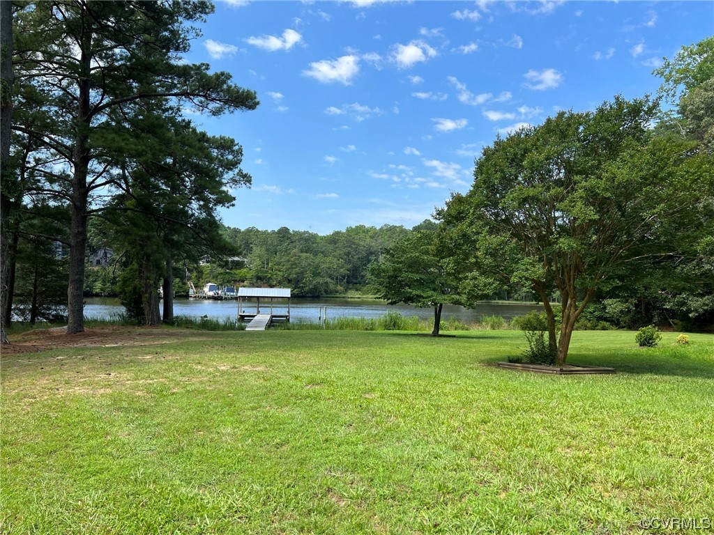 1065 Griffin's Landing Road Lancaster, VA 22503 - Photo 2 of 18 a view of a swimming pool and a yard