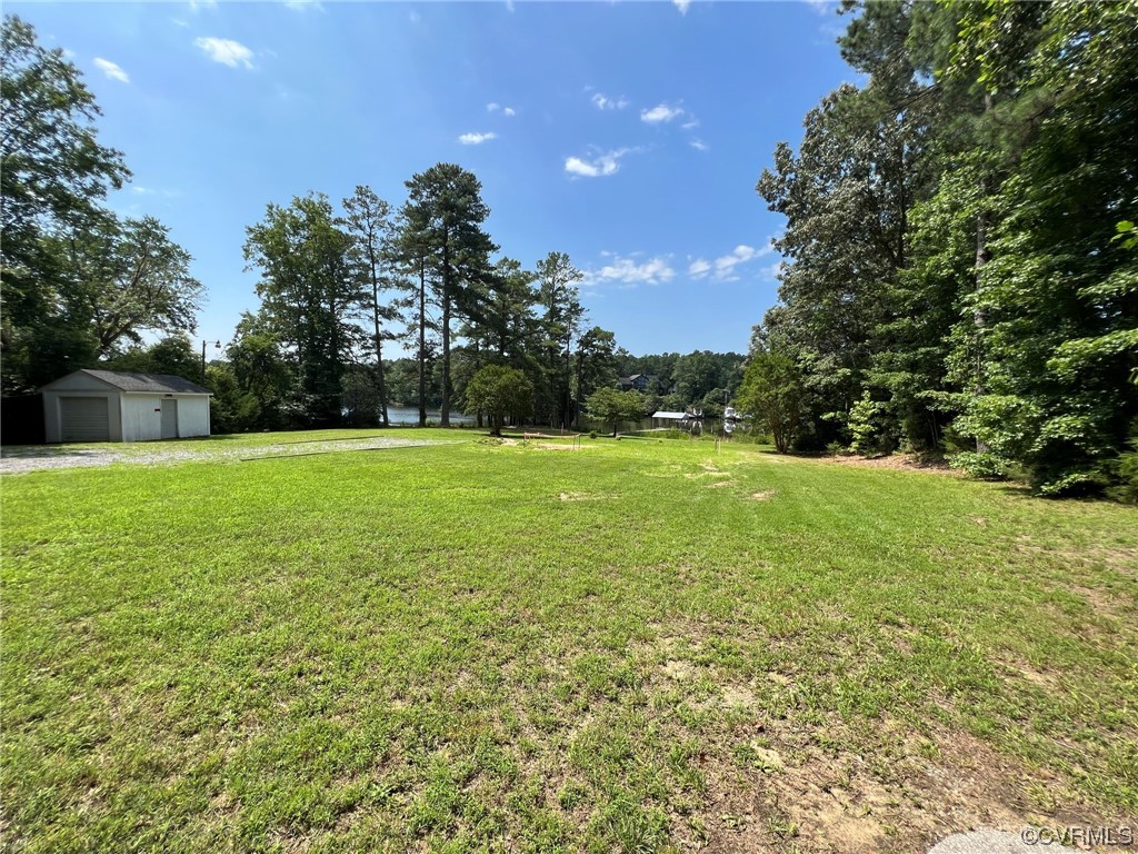 1065 Griffin's Landing Road Lancaster, VA 22503 - Photo 3 of 18 a view of a green field with trees in the background
