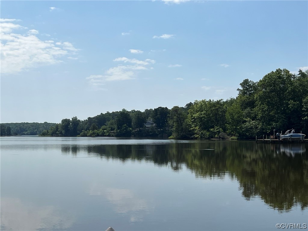 1065 Griffin's Landing Road Lancaster, VA 22503 - Photo 9 of 18 a view of a lake with houses in the back