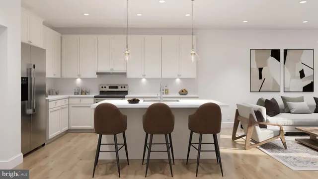 a kitchen with stainless steel appliances granite countertop a stove a sink a refrigerator white cabinets with a dining table and chairs