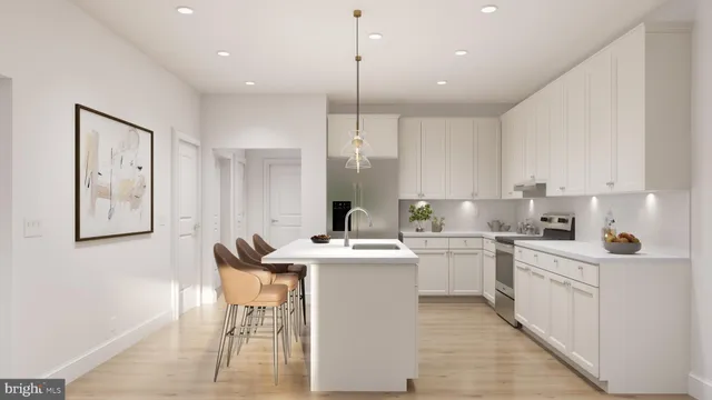 a kitchen with stainless steel appliances granite countertop a sink a stove a refrigerator and island with wooden floor