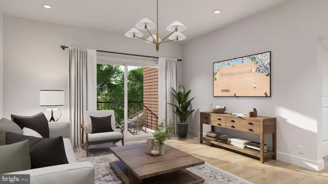 a living room with furniture a window and a chandelier