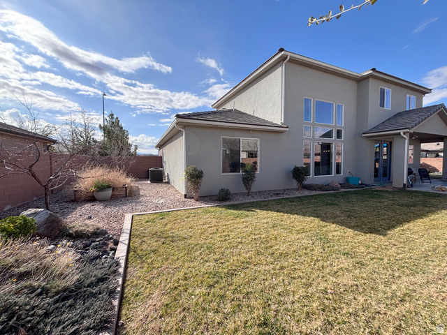 429 East Treasure Road Washington, UT 84780 - Photo 33 of 36 Back of property featuring stucco siding, a patio, and a fenced backyard