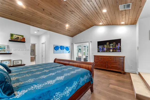 a view of a house with backyard sitting area and garden