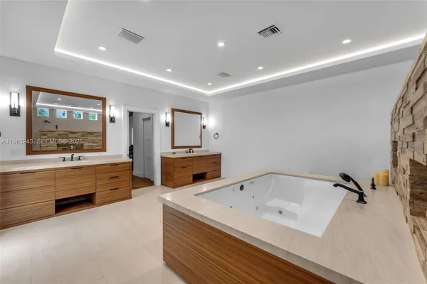 a view of a backyard with plants and palm tree