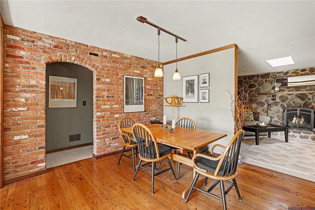 1722 Strong Road Victor, NY 14564 - Photo 5 of 33 Formal dining area with hardwood floors, curved ar