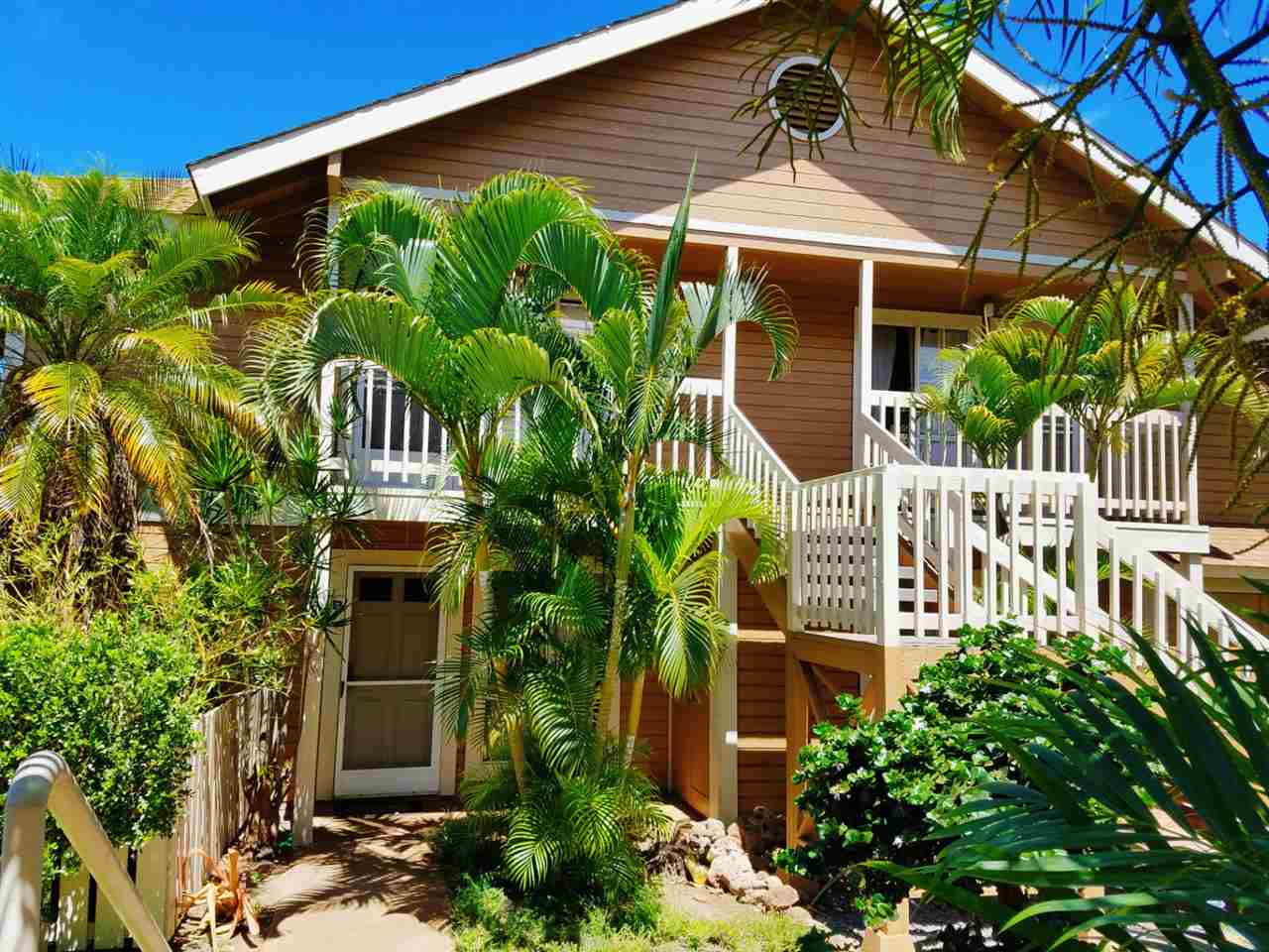 140 Uwapo Road, Unit 22204 Kihei, HI 96753 - Photo 1 of 19 a front view of a house with a yard