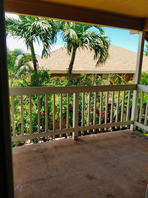 140 Uwapo Road, Unit 22204 Kihei, HI 96753 - Photo 3 of 19 a view of a building with floor to ceiling windows and a palm tree