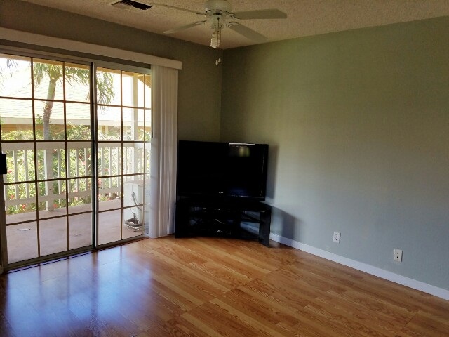 140 Uwapo Road, Unit 22204 Kihei, HI 96753 - Photo 5 of 19 wooden floor and windows in a room