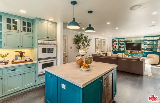 a front view of a house with a yard and fountain