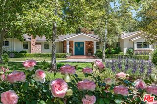 5840 Round Meadow Road Hidden Hills, CA 91302 - Photo 27 of 28 a front view of a house with a yard and fountain