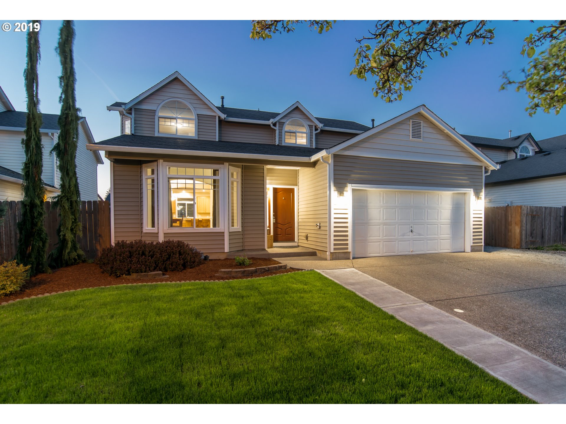 2014 North Falcon Drive Ridgefield, WA 98642 - Photo 1 of 32 a front view of a house with a yard and garage