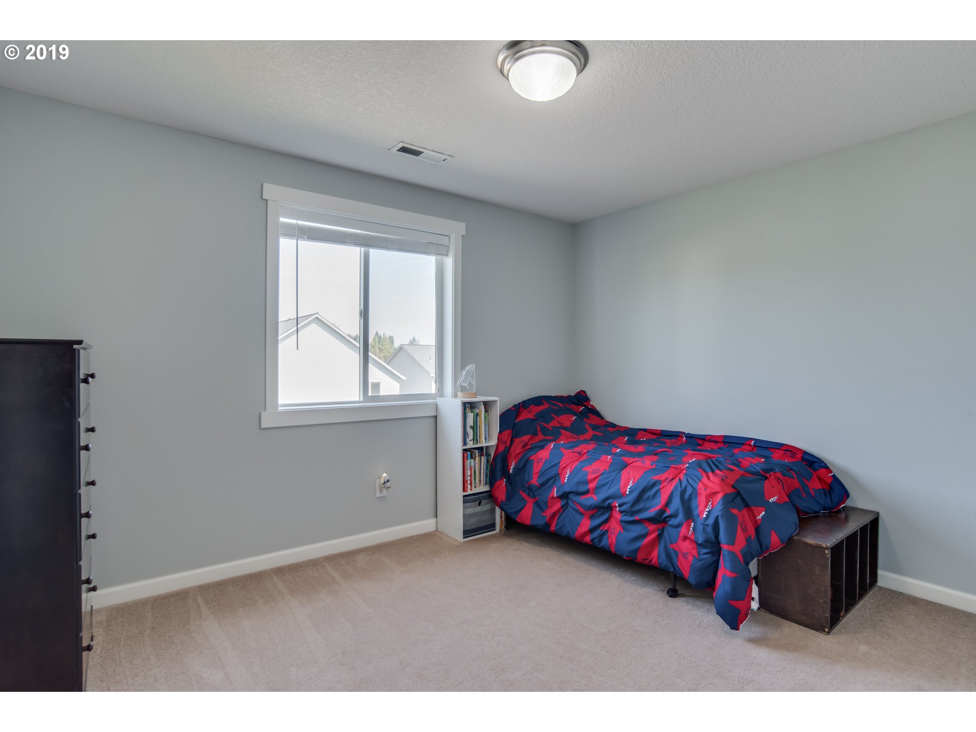 2014 North Falcon Drive Ridgefield, WA 98642 - Photo 13 of 32 a bedroom with a bed and a window