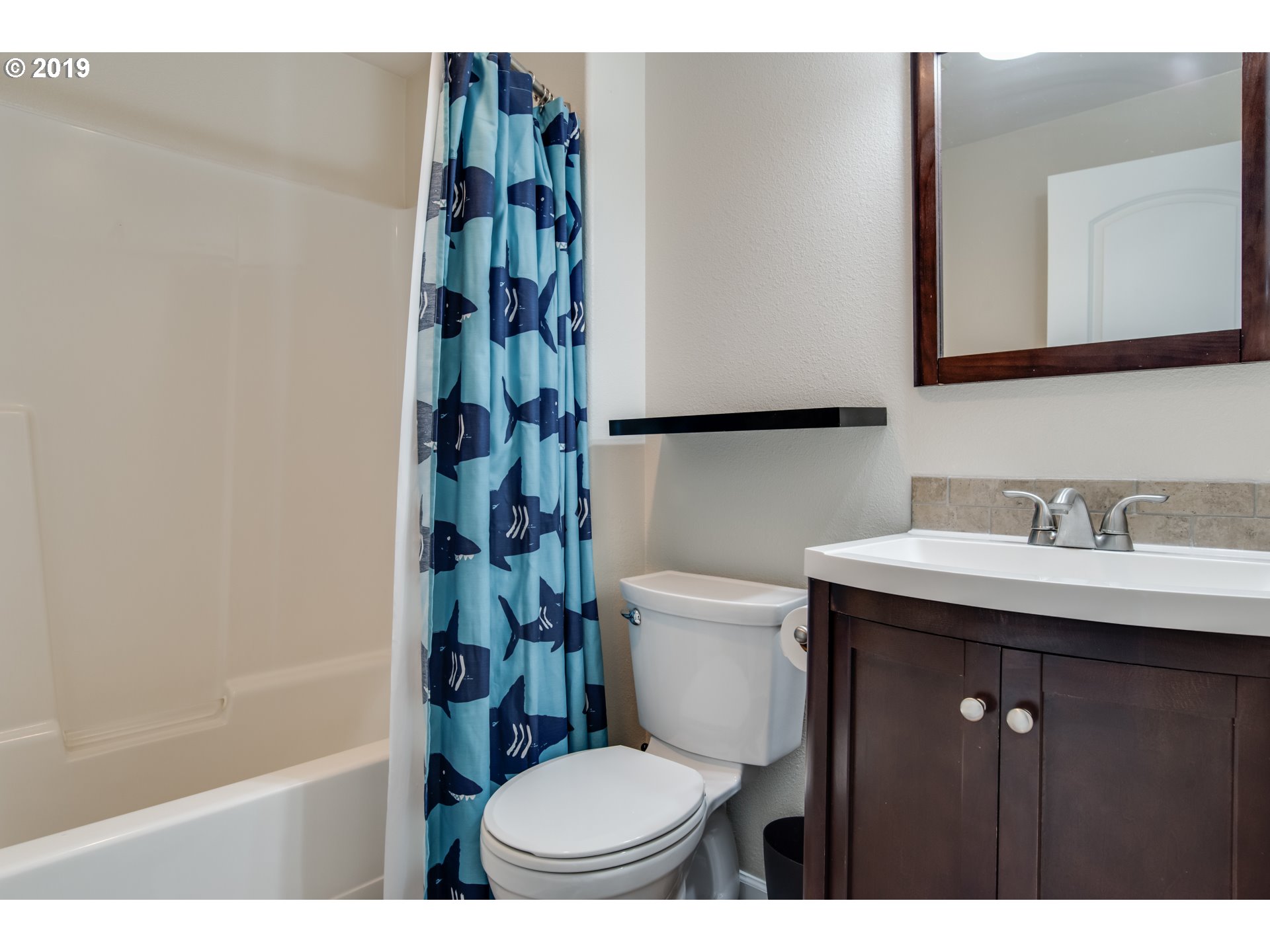 2014 North Falcon Drive Ridgefield, WA 98642 - Photo 15 of 32 a bathroom with a sink toilet and shower