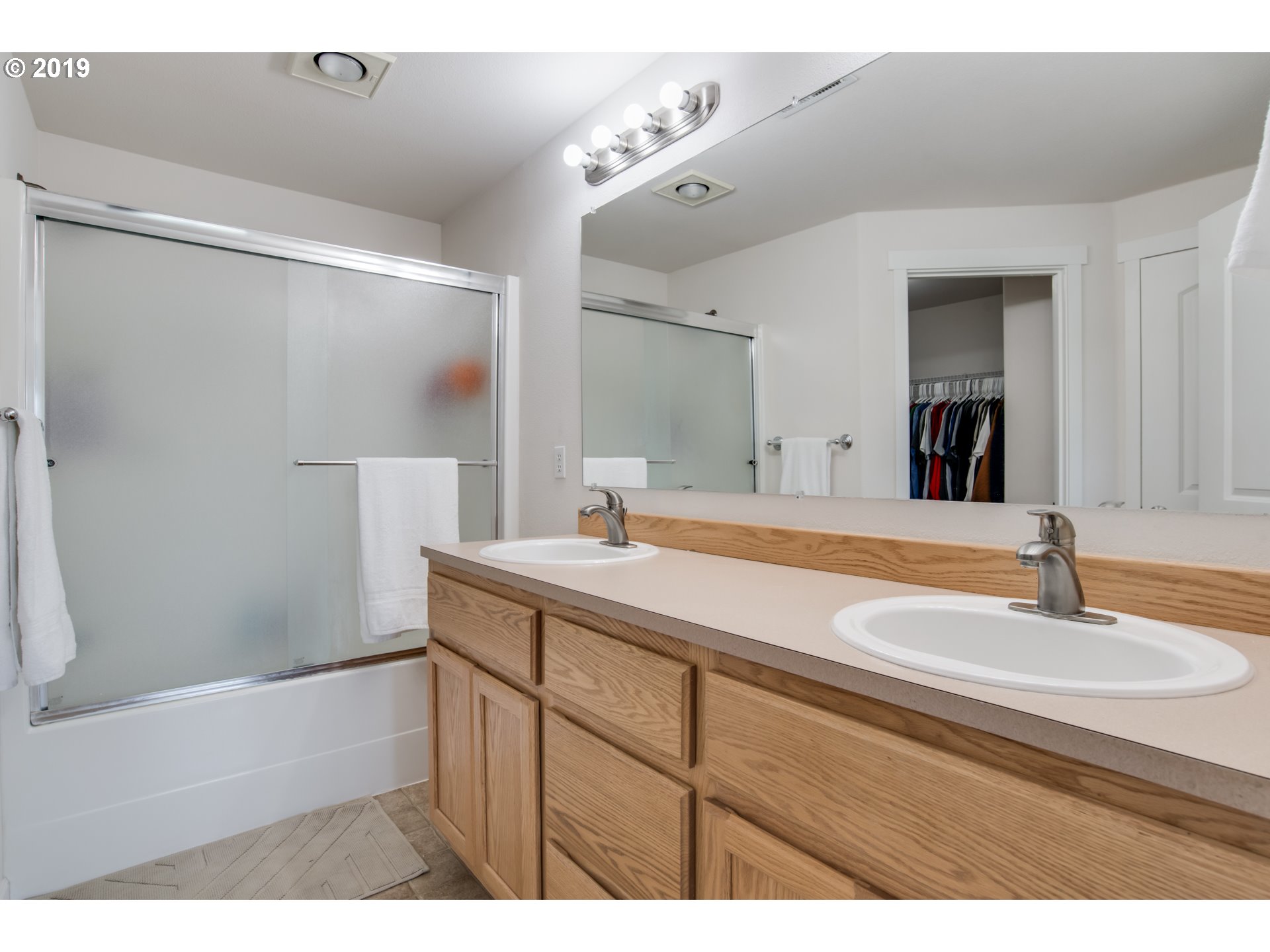 2014 North Falcon Drive Ridgefield, WA 98642 - Photo 19 of 32 a bathroom with a sink and a mirror
