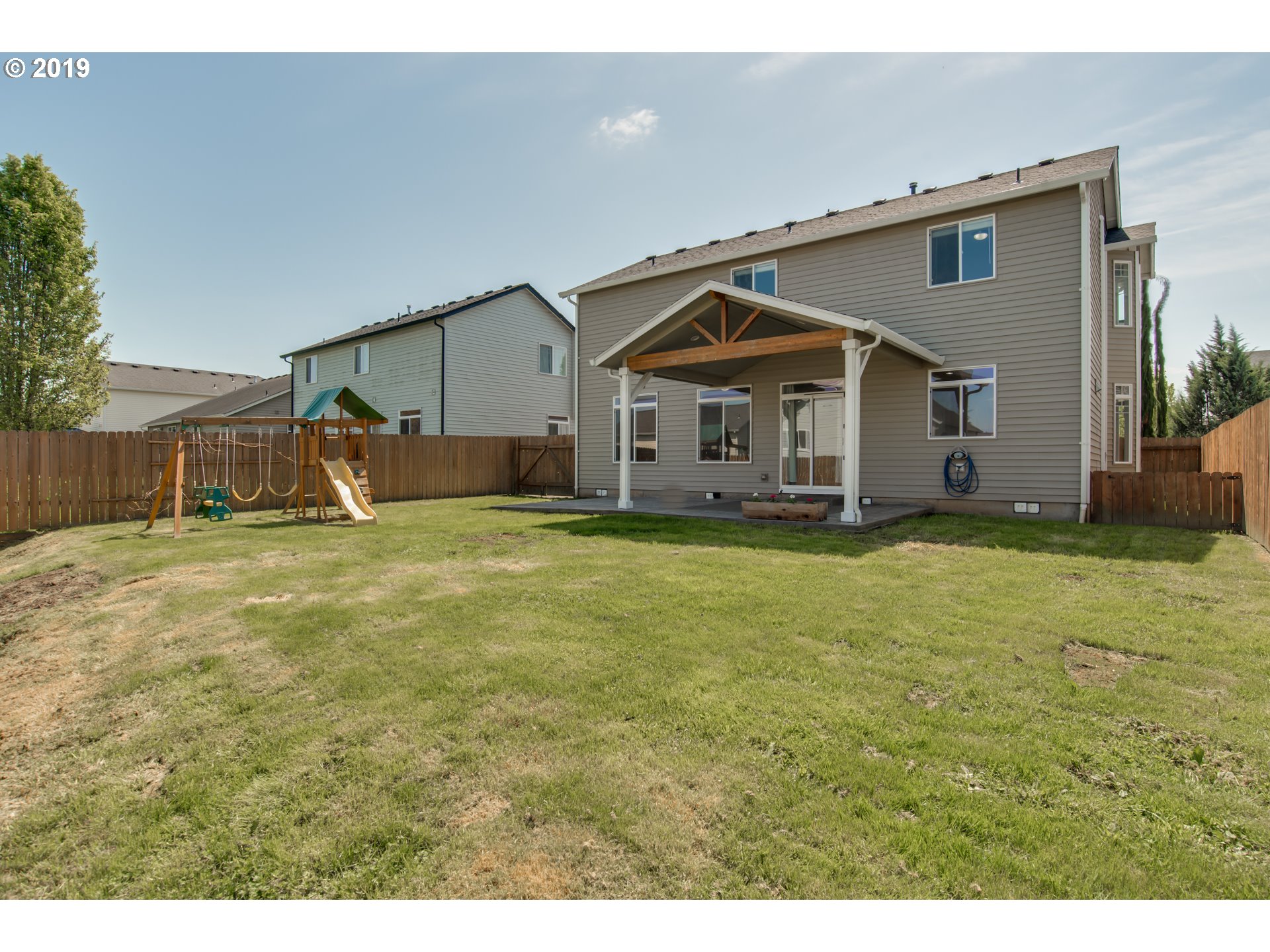 2014 North Falcon Drive Ridgefield, WA 98642 - Photo 29 of 32 a view of a house with a yard