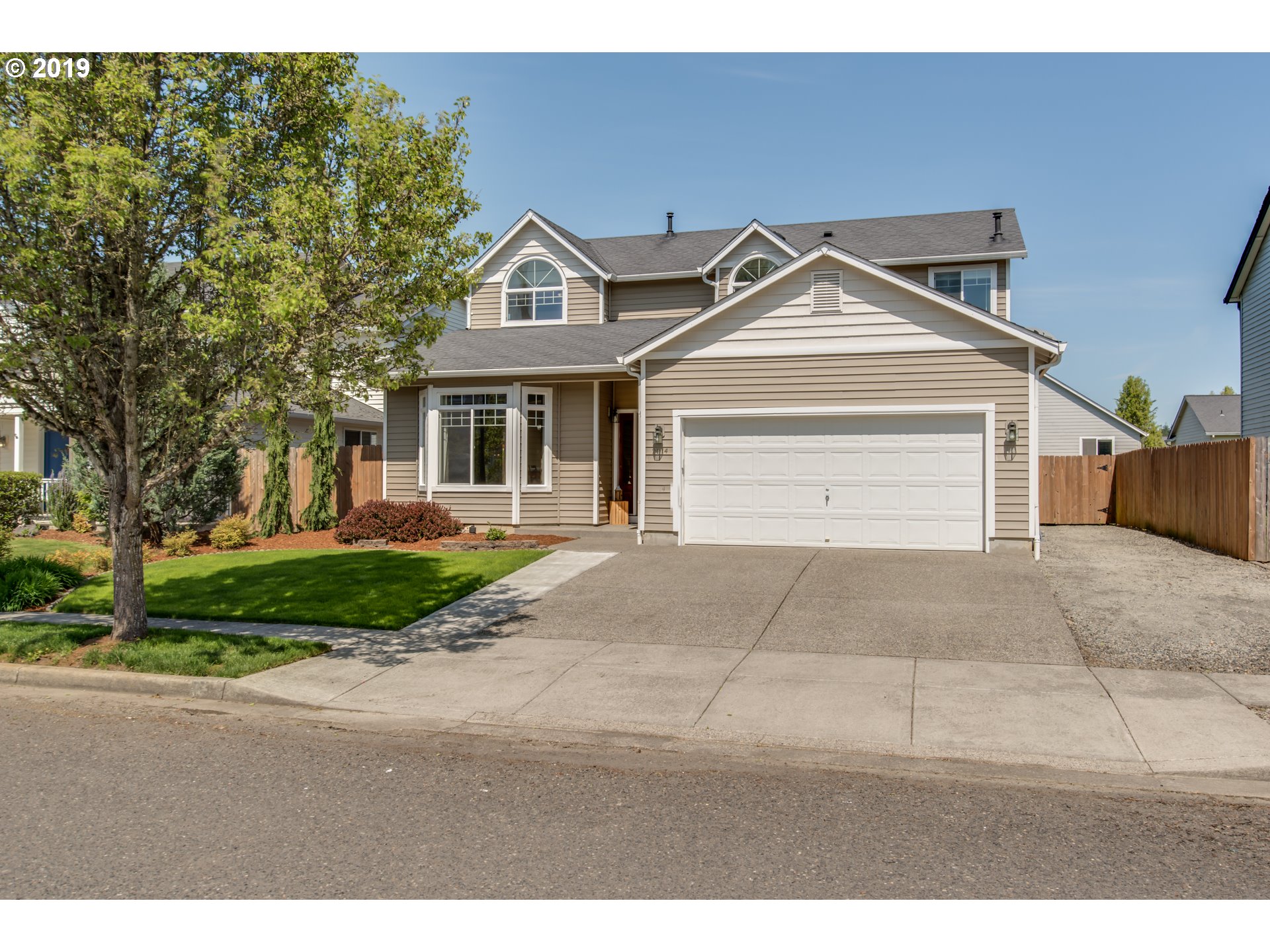 2014 North Falcon Drive Ridgefield, WA 98642 - Photo 31 of 32 a front view of a house with a yard and garage