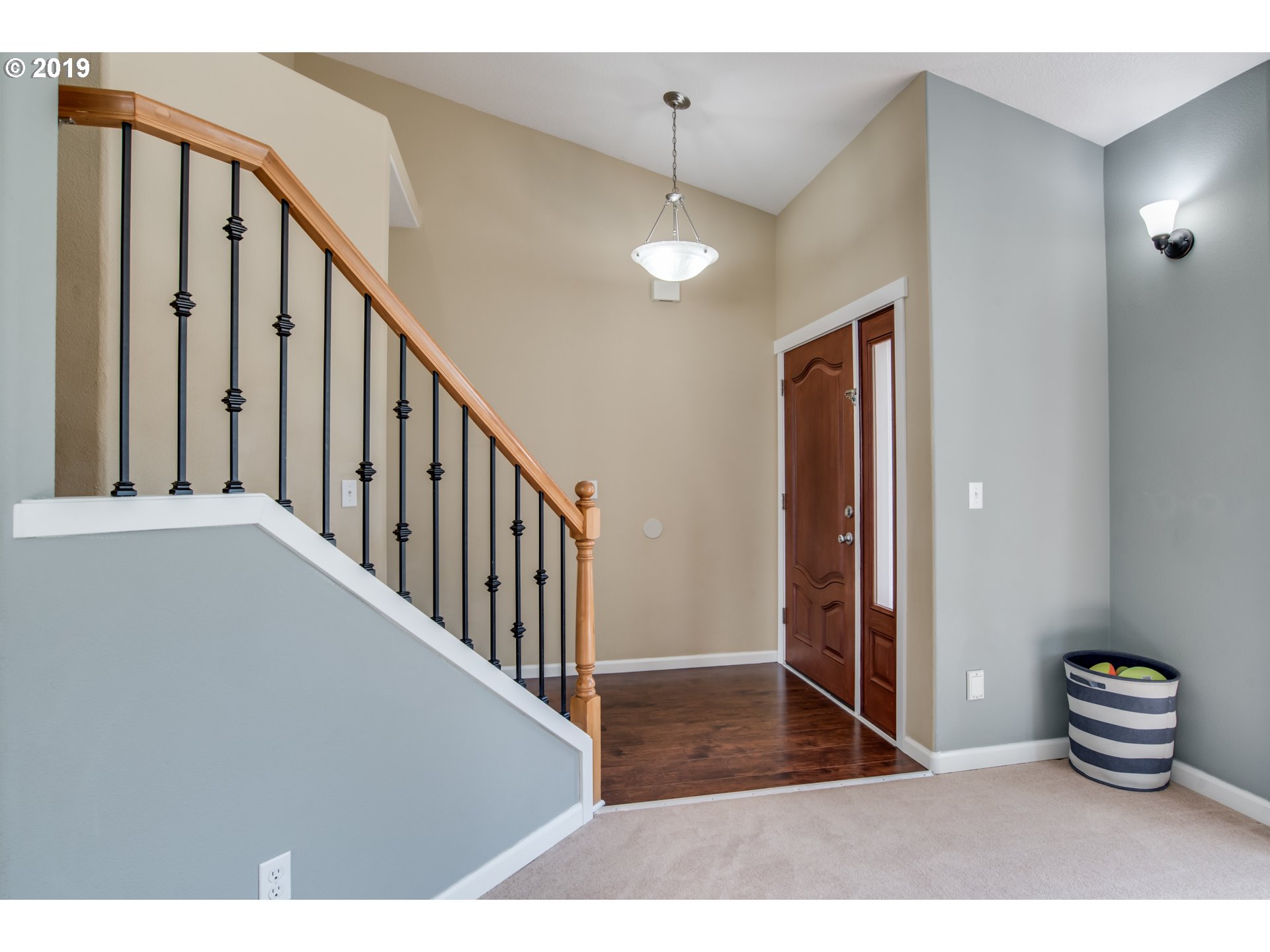 2014 North Falcon Drive Ridgefield, WA 98642 - Photo 4 of 32 a view of a hallway with wooden floor and staircase