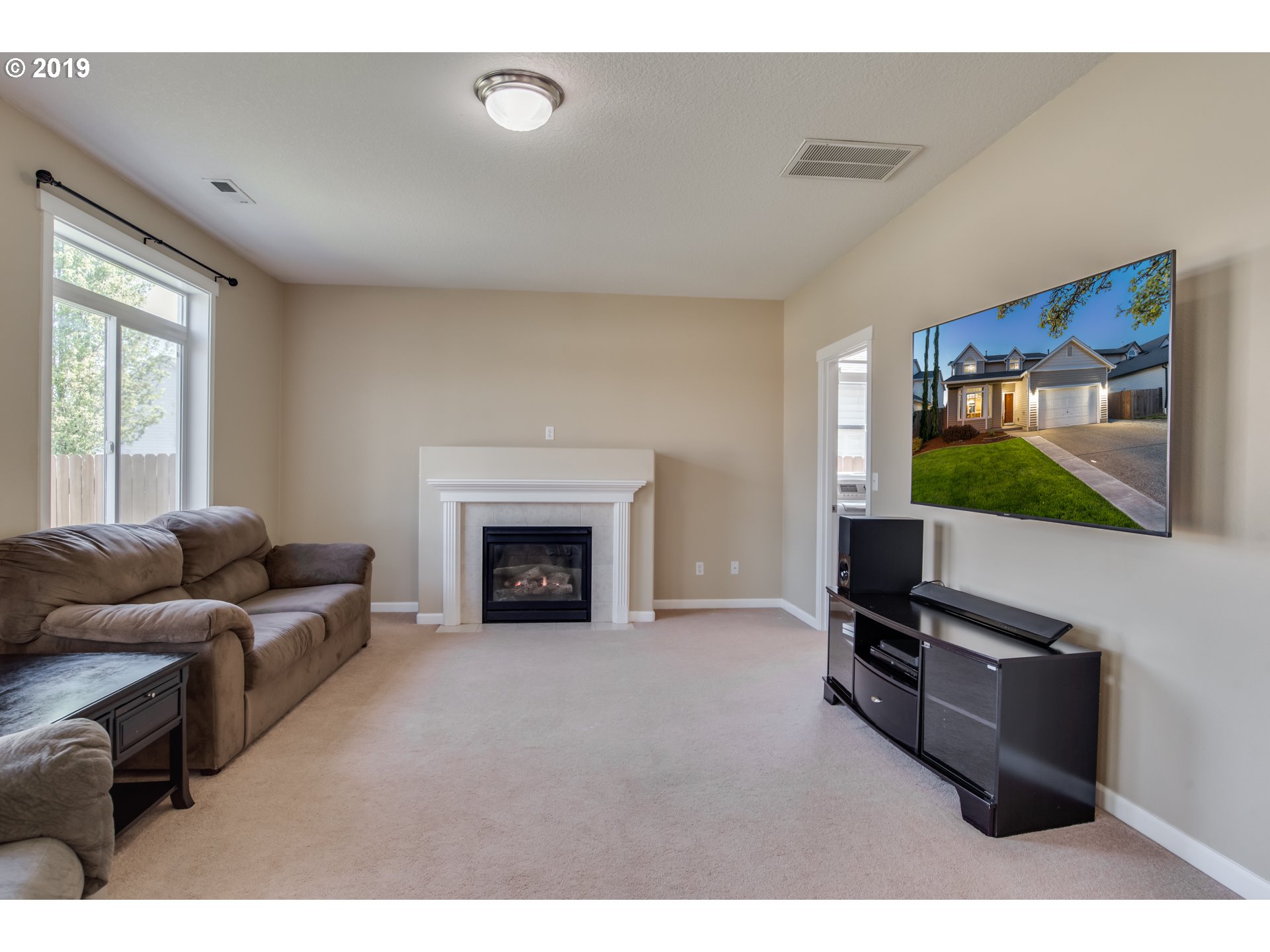 2014 North Falcon Drive Ridgefield, WA 98642 - Photo 9 of 32 a living room with furniture and a flat screen tv