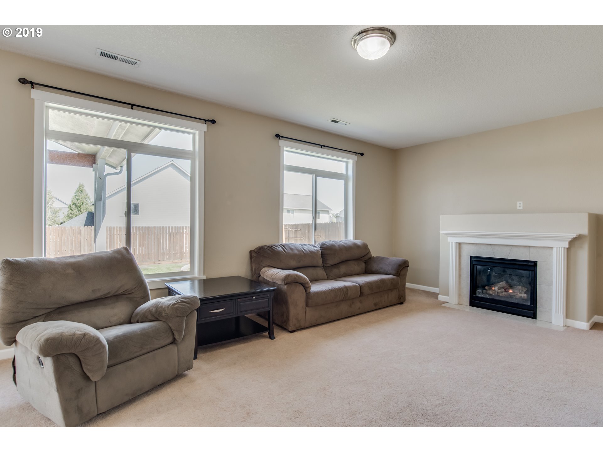 2014 North Falcon Drive Ridgefield, WA 98642 - Photo 10 of 32 a living room with furniture and a fireplace